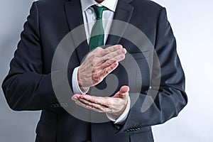 Well dressed businessman in white shirt and black suit.