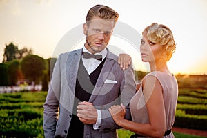 Well-dressed couple in a park