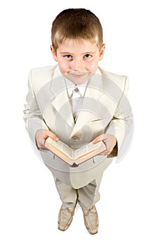 Well-dressed smiling boy hold book