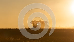 Well drilling rig silhouette at sunset