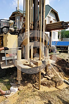 Well drilling on the water, the installation is in the car, the drilling process is close-up