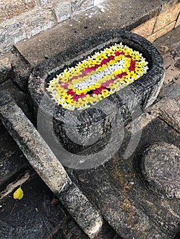 Well full of flowers in Dambulla cave temple