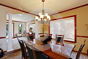 Well furnished dining room with elegant chandelier
