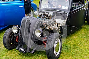 Well groomed black Hot Rod Ford from 1932 with open hood