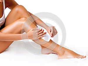 Well-groomed Woman Legs After Depilation Isolated on White