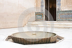 Well head and fountain in a courtyard