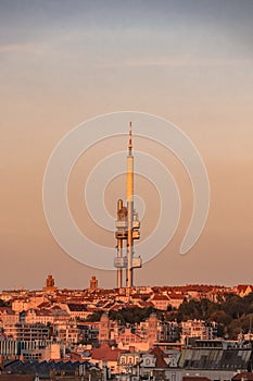 Well-known Czech tourist attraction in the capital city of Prague. The Zizkov TV tower at sunset towers over the entire city.
