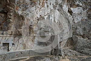 The well-known relief of a Rhodian trireme, warship, cut into the rock at the foot of the steps leading to the acropolis. Rhodes