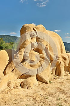 Well made sand sculpture of elephant family