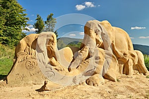 Well made sand sculpture of elephant family