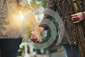 Well never let go. Closeup shot of a loving couple holding hands.