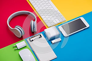 Well organised white office objects on colorful background