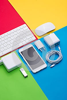 Well organised white office objects on colorful background