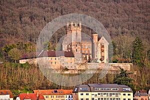 Well preserved medieval German hill castle called `Mittelburg`, in Odenwald forest in German city Neckarsteinach