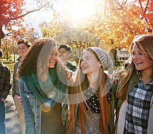 Well remember these memories forever. a group of teenage friends enjoying an autumn day outside together.