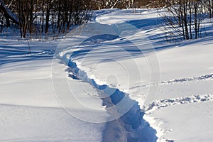 Well-trodden path through deep snow