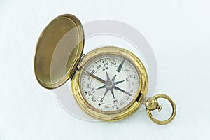 Well used US military compass isolated on white back ground.