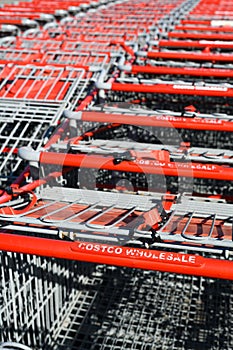 Well worn handles of Costco Wholesale shopping carts