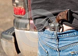 Pistol Tucked into Jeans photo
