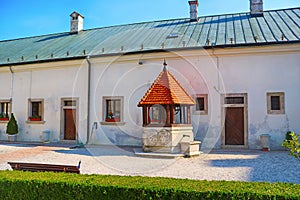 Well on the yard in the Red Stone Castle near the settlement called Pila in Slovakia photo