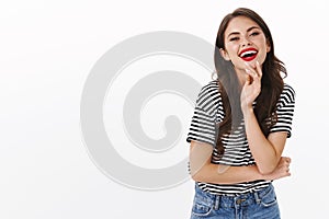 Wellbeing, happiness, and emotions concept. Cheerful coquettish stylish woman, laughing carefree enjoying summer photo