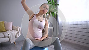 Wellbeing and prenatal fitness pregnant lady does side bends Spbd