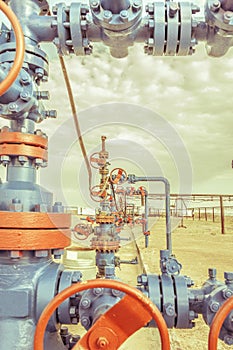 Wellheads with valve armature on a oil field.