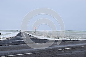 road intersection with the main road to Welling in winter photo
