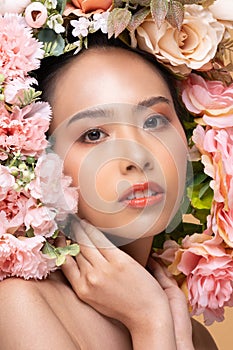 Wellness Beauty Asian Woman touch neck and bouquet of flowers around her face,Pretty young woman with clean and fresh skin shine