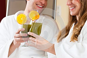 Wellness - Couple with Chlorophyll-Shake in Spa