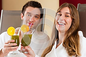 Wellness - Couple with Chlorophyll-Shake in Spa