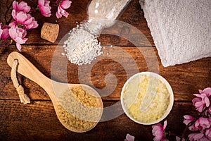 Wellness setting. Sea salt in bowl, towel, massage brush and pin