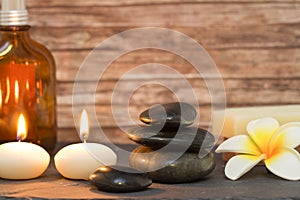 Wellness and spa composition candles with massage stones