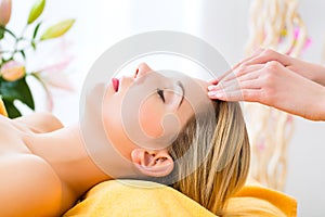 Wellness - woman getting head massage in Spa