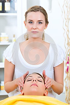 Wellness - woman getting head massage in Spa