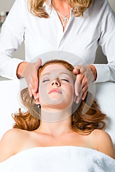 Wellness - woman getting head massage in Spa