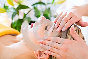 Wellness - woman getting head massage in Spa