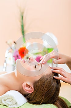 Wellness - woman getting head massage in Spa