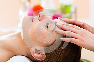 Wellness - woman getting head massage in Spa