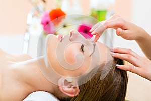 Wellness - woman getting head massage in Spa