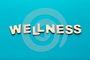 Wellness word arranged with wooden letters