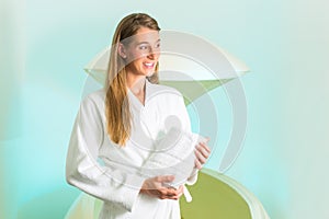 Wellness - young woman floating in Spa in Tank