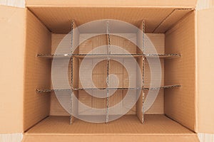 Wellstructured Cardboard Box equipped with Dividers designed for Efficient Storage of Items photo