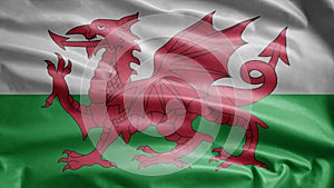 Welsh flag waving in the wind. Close up of Wales banner blowing soft silk