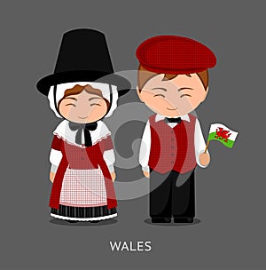 Welsh in national dress with a flag. photo