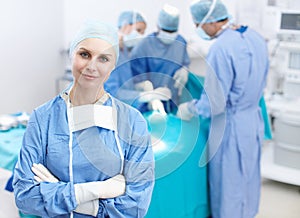 Were the best in the business. Portrait of a happy female surgeon smiling in an operating theatre - Copyspce.