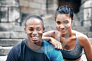 Were both fitness fanatics. Portrait of a sporty young couple exercising together outdoors in the city.