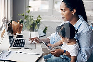 Were both working really hard. a young mother caring for her baby girl while working from home.