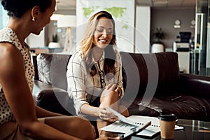 Were flipping the script on the business world. two young businesswomen using a digital tablet while going over some