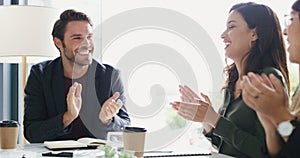 Were going to keep growing and succeeding together. a group of businesspeople applauding during a meeting in a boardroom